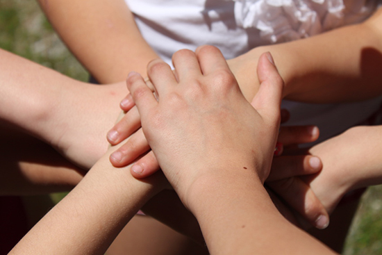 Hands signifying a friendship pact