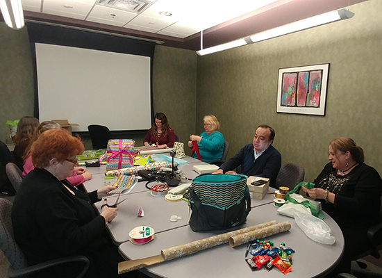 DSCC's Springfield Regional Office wraps presents for a DSCC toddler in need.