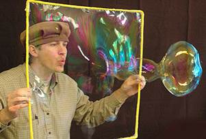 Geoff Akins blowing bubble picture