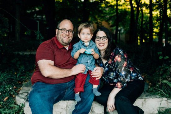 DSCC participant Jakob Kojro-Badziak smiling and posing with his parents, Jason and Jennifer