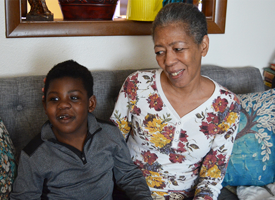 Nedra Whitted smiles at her grandson Stanton as the two sit together