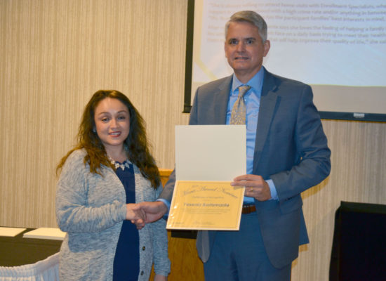 2019 DSCC Award of Merit Winner Yesenia Bustamante shakes hands with Executive Director Thomas Jerkovitz
