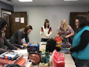 DSCC's Olney staff have a "wrapping party" for families in need.