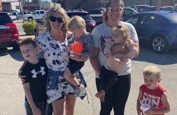 Lace Mandrell and Bailey Imig pose and smile with their children