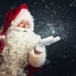 Santa with his bag and blowing magic snow out of his hand