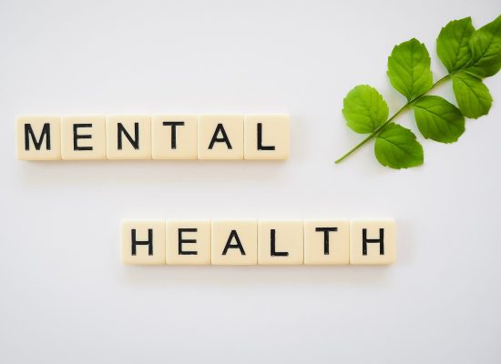 The words "Mental Health" spelled out with individual letter tiles