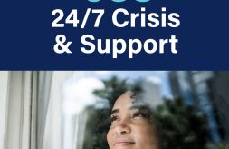 A dark-skinned woman looking out a window and smiling with text above her that says "988 24/7 Crisis & Support"