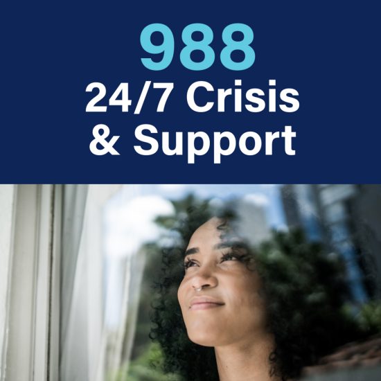 A dark-skinned woman looking out a window and smiling with text above her that says "988 24/7 Crisis & Support"