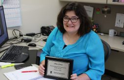 Amy Jones, Regional Manager of DSCC’s Olney and Marion regional offices, holds her Outstanding Field Instructor Award