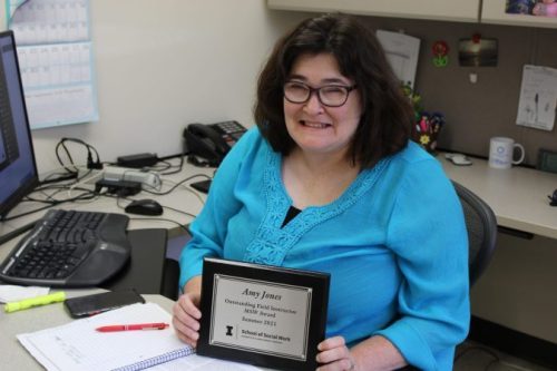 Amy Jones, Regional Manager of DSCC’s Olney and Marion regional offices, holds her Outstanding Field Instructor Award