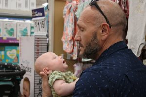 PCA Jimmy Baldi holds baby Liam during the shopping trip