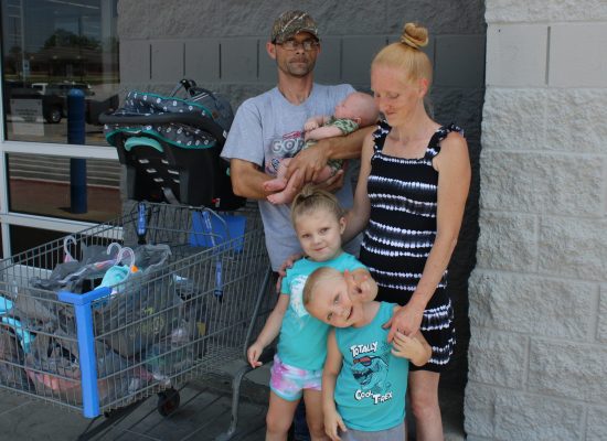 DSCC participant Renesmae poses together with her two little brothers and mom and dad outside Walmart